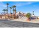 Single-story house with a two-car garage and palm trees at 278 Iron Duke Ave, Las Vegas, NV 89183