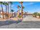 Beautiful single-story home with mature palm trees and a three-car garage at 278 Iron Duke Ave, Las Vegas, NV 89183