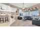 Living room with hardwood floors, two sofas and ceiling fan at 278 Iron Duke Ave, Las Vegas, NV 89183