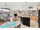 View from the dining area showing the kitchen and living room with hardwood and tile flooring throughout at 278 Iron Duke Ave, Las Vegas, NV 89183