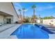 Stunning pool with adjacent patio and seating at 278 Iron Duke Ave, Las Vegas, NV 89183