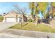 Single-story house with a two-car garage and a landscaped front yard at 279 Windsong Echo Dr, Henderson, NV 89012