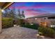 Landscaped backyard with patio, water feature, and fire pit at 3018 Fall Solstice Ct, Las Vegas, NV 89138