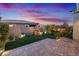 Landscaped backyard with patio, water feature, and fire pit at 3018 Fall Solstice Ct, Las Vegas, NV 89138