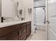 Clean bathroom with a shower/tub combo and double vanity at 3018 Fall Solstice Ct, Las Vegas, NV 89138