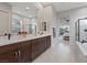 Modern bathroom with double vanity and a view into the bedroom at 3018 Fall Solstice Ct, Las Vegas, NV 89138