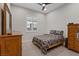 Charming bedroom with a dresser and a window with plantation shutters at 3018 Fall Solstice Ct, Las Vegas, NV 89138