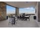 Covered patio with seating and mountain views at 3018 Fall Solstice Ct, Las Vegas, NV 89138