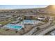 Resort-style pool area with lounge chairs and palm trees at 3018 Fall Solstice Ct, Las Vegas, NV 89138