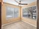 Bright room features two windows with blinds, tan tiled flooring, and a modern ceiling fan at 3038 Casey Dr # 204, Las Vegas, NV 89120