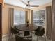 This dining area is illuminated by a ceiling fan and wrapped by bright windows, offering a cozy space for meals at 3038 Casey Dr # 204, Las Vegas, NV 89120