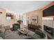Cozy living room features stylish furniture, a mosaic fireplace, and an open layout connecting to the dining area at 3038 Casey Dr # 204, Las Vegas, NV 89120