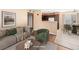 Bright living room features a comfortable couch and chairs, along with a view into the connected kitchen and dining area at 3038 Casey Dr # 204, Las Vegas, NV 89120
