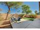 Landscaped backyard with patio and seating area at 3060 Lapis Beach Dr, Las Vegas, NV 89117