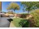 Landscaped backyard with patio and grass area at 3060 Lapis Beach Dr, Las Vegas, NV 89117