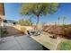 Backyard patio with seating area and grass at 3060 Lapis Beach Dr, Las Vegas, NV 89117