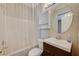 Clean bathroom with a tub, shower, vanity, and linen cabinet at 3060 Lapis Beach Dr, Las Vegas, NV 89117