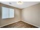 Simple bedroom with hardwood floors and a window with blinds at 3060 Lapis Beach Dr, Las Vegas, NV 89117