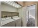 Laundry room with washer, dryer, and shelving at 3060 Lapis Beach Dr, Las Vegas, NV 89117