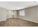 Bright living room featuring wood-look floors and an entryway at 3060 Lapis Beach Dr, Las Vegas, NV 89117