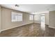 Spacious living room with wood-look flooring and neutral walls at 3060 Lapis Beach Dr, Las Vegas, NV 89117