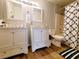 Double vanity bathroom with white cabinets and granite countertop at 3083 Casey Dr # 101, Las Vegas, NV 89120