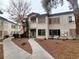 Two-story condo building with light-colored exterior and landscaping at 3083 Casey Dr # 101, Las Vegas, NV 89120