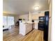 Kitchen with light wood cabinets and black appliances at 3083 Casey Dr # 101, Las Vegas, NV 89120