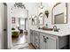 Elegant bathroom with double vanity and a view into a bedroom at 3119 Crownline Ct, North Las Vegas, NV 89031