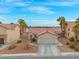 Single story home with tile roof and garage at 3119 Crownline Ct, North Las Vegas, NV 89031