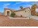 Tan house with a one-car garage and small front yard at 3119 Crownline Ct, North Las Vegas, NV 89031