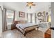 Relaxing main bedroom with hardwood floors and a ceiling fan at 3119 Crownline Ct, North Las Vegas, NV 89031