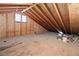 Unfinished attic featuring exposed wooden beams and flooring, offering potential for customization at 3280 James A Bilbray Pkwy, Laughlin, NV 89029