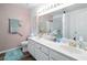 Well-lit bathroom with double sinks, a wide mirror, and a shower-tub combination with modern fixtures at 3280 James A Bilbray Pkwy, Laughlin, NV 89029