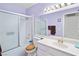 Bathroom showcasing a shower-tub combo, white vanity, and a large mirror at 3280 James A Bilbray Pkwy, Laughlin, NV 89029