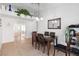 Dining room with a table and chairs, sliding mirrored closet doors, and views into the adjacent spaces at 3280 James A Bilbray Pkwy, Laughlin, NV 89029