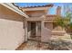 Close-up of the front door and entrance with a view of the chimney and desert landscaping at 3280 James A Bilbray Pkwy, Laughlin, NV 89029