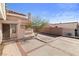 Front entrance and courtyard featuring desert landscaping and a patterned concrete area at 3280 James A Bilbray Pkwy, Laughlin, NV 89029