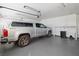 Well-lit garage featuring a parked truck, with built-in storage solutions for organization and convenience at 3280 James A Bilbray Pkwy, Laughlin, NV 89029