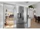 Modern stainless steel refrigerator in kitchen leading to dining room, with views into the living room at 3280 James A Bilbray Pkwy, Laughlin, NV 89029