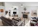 Bright living room featuring neutral walls, tile floor, fireplace, ceiling fans, and a comfortable seating arrangement at 3280 James A Bilbray Pkwy, Laughlin, NV 89029