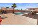 Inviting backyard with a sparkling pool, covered patio, and ample space for relaxation and entertainment at 3280 James A Bilbray Pkwy, Laughlin, NV 89029