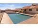 Inviting backyard featuring a refreshing pool, covered patio, and a well-maintained outdoor space at 3280 James A Bilbray Pkwy, Laughlin, NV 89029