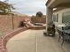 Spacious backyard with a spa, waterfall, and patio furniture at 3310 Fernbird Ln, North Las Vegas, NV 89084