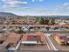 Aerial view showcasing the house, neighborhood, and distant mountain views at 350 Preston Dr, Henderson, NV 89015