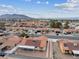 Aerial view showcasing the house, neighborhood, and distant mountain views at 350 Preston Dr, Henderson, NV 89015