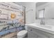 Clean bathroom, featuring gray vanity and floral shower curtain at 350 Preston Dr, Henderson, NV 89015