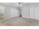 Spacious bedroom with mirrored closet doors and neutral wall colors at 350 Preston Dr, Henderson, NV 89015