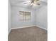 Bright bedroom with ceiling fan and neutral carpet at 350 Preston Dr, Henderson, NV 89015