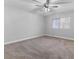 Bright bedroom with ceiling fan and neutral carpeting at 350 Preston Dr, Henderson, NV 89015